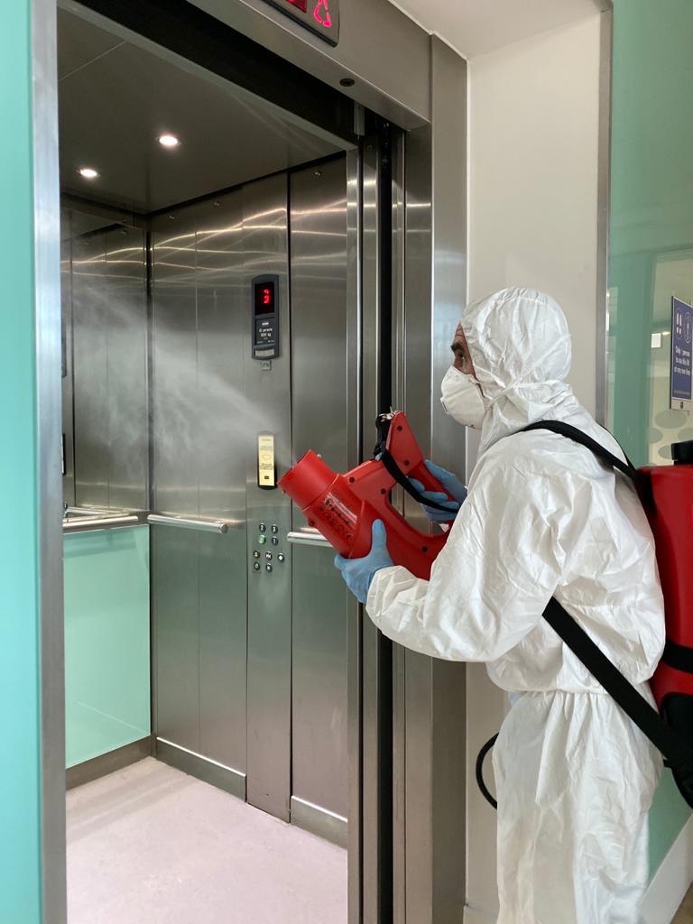 Man cleaning using Bio Fogging in lift