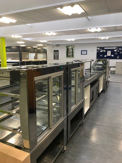 Deep cleaning on kitchen equipment in a school
